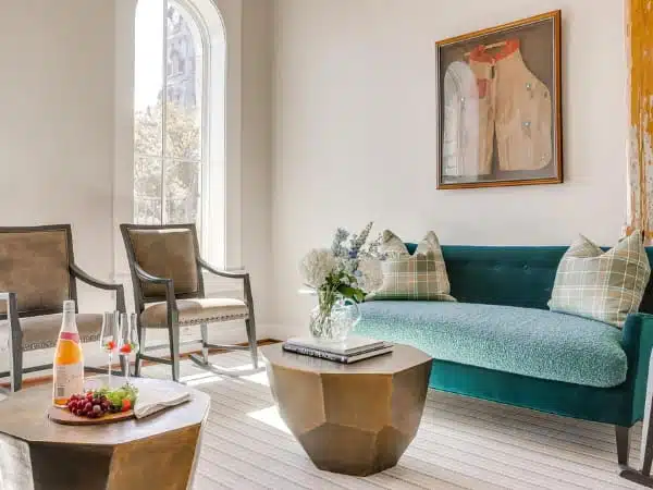 Nutt House Hotel sitting room with couch, chairs, and wine and cheese